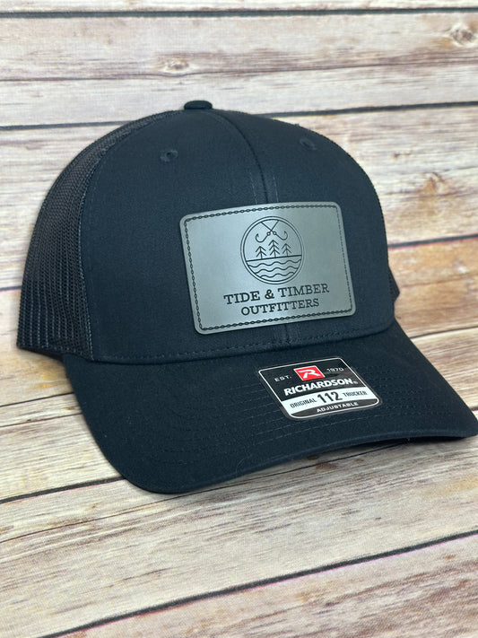 Black T&T logo trucker hat