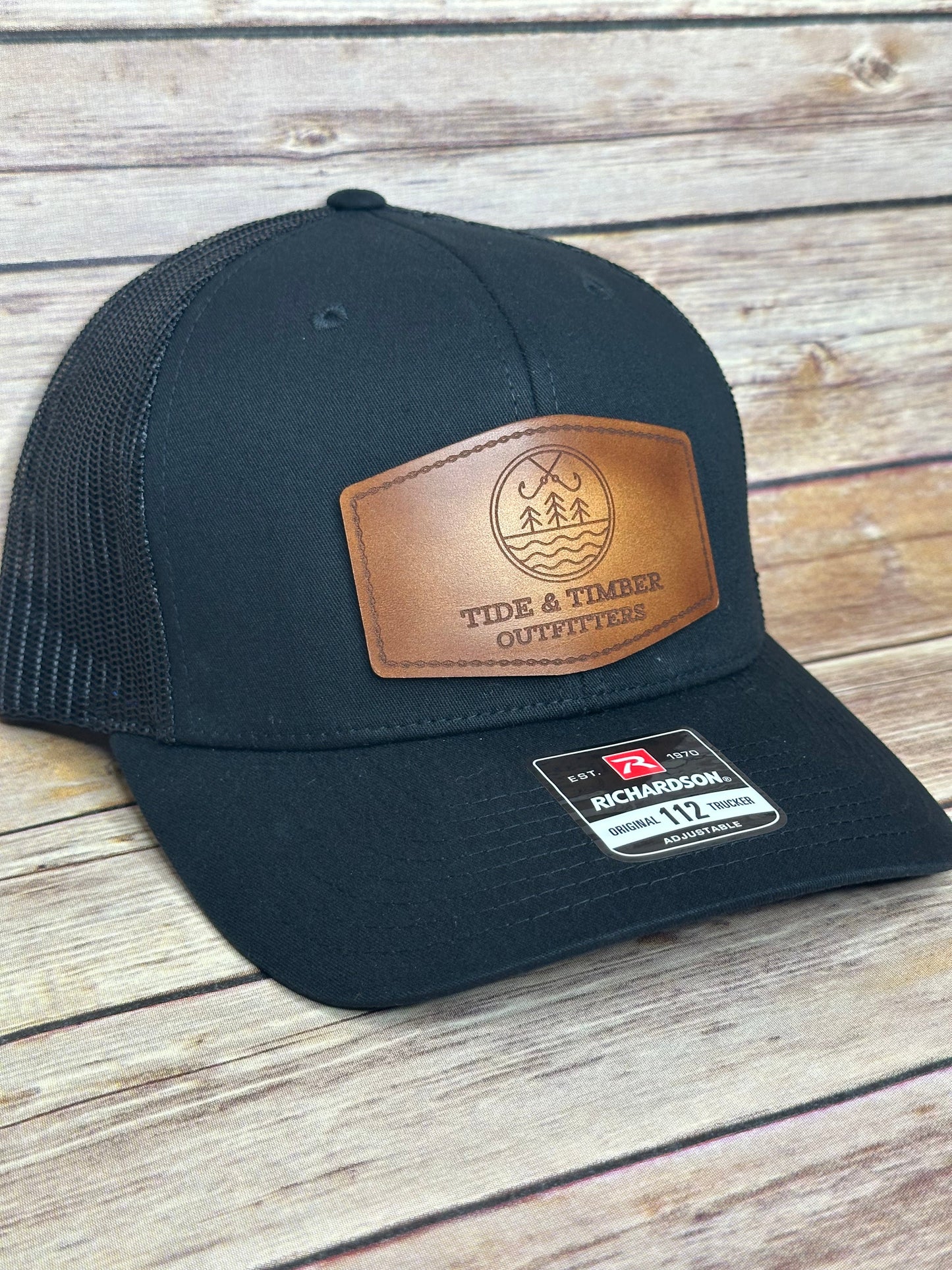Black T&T logo trucker hat