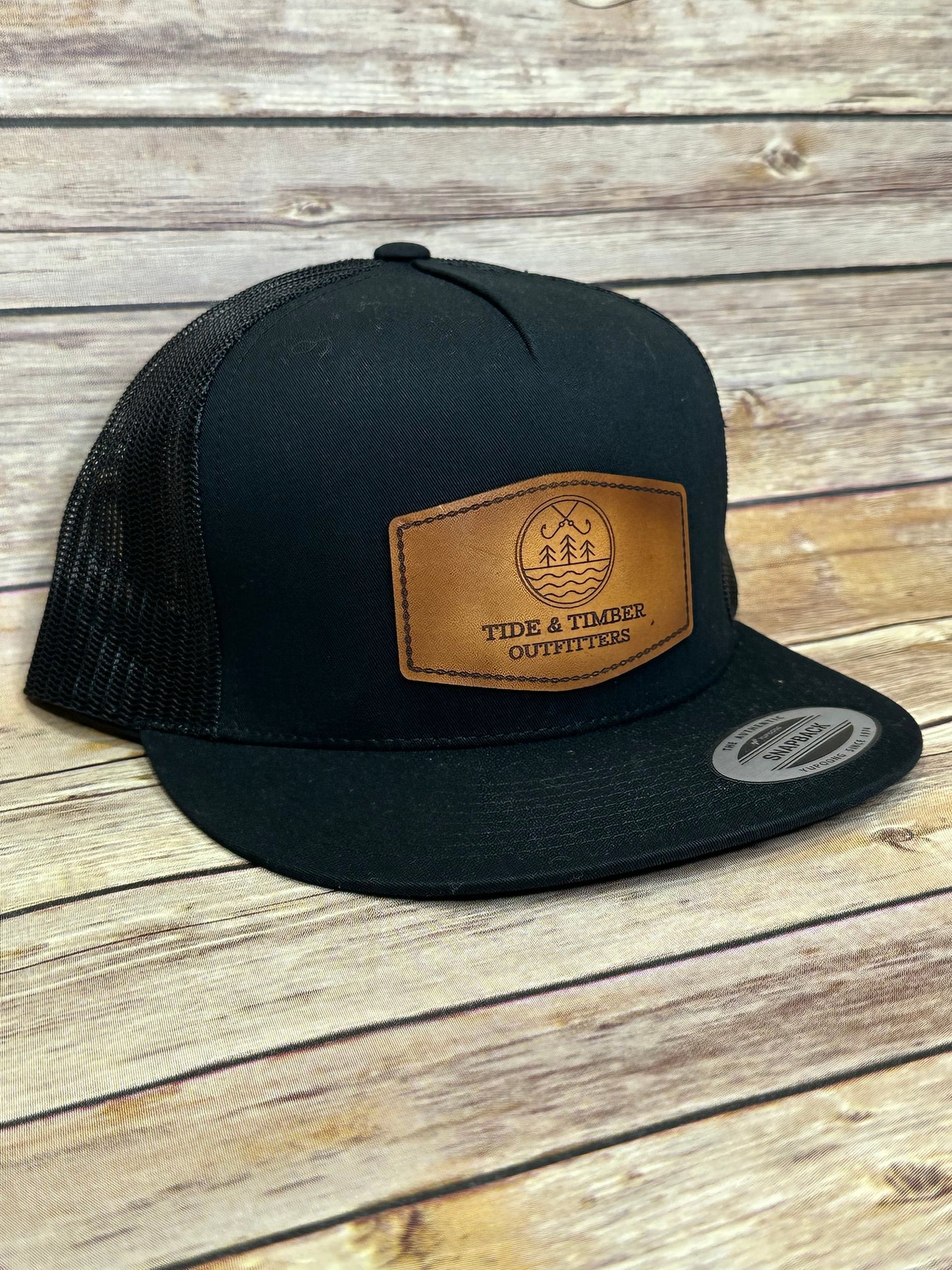 Black flat bill T&T logo trucker hat