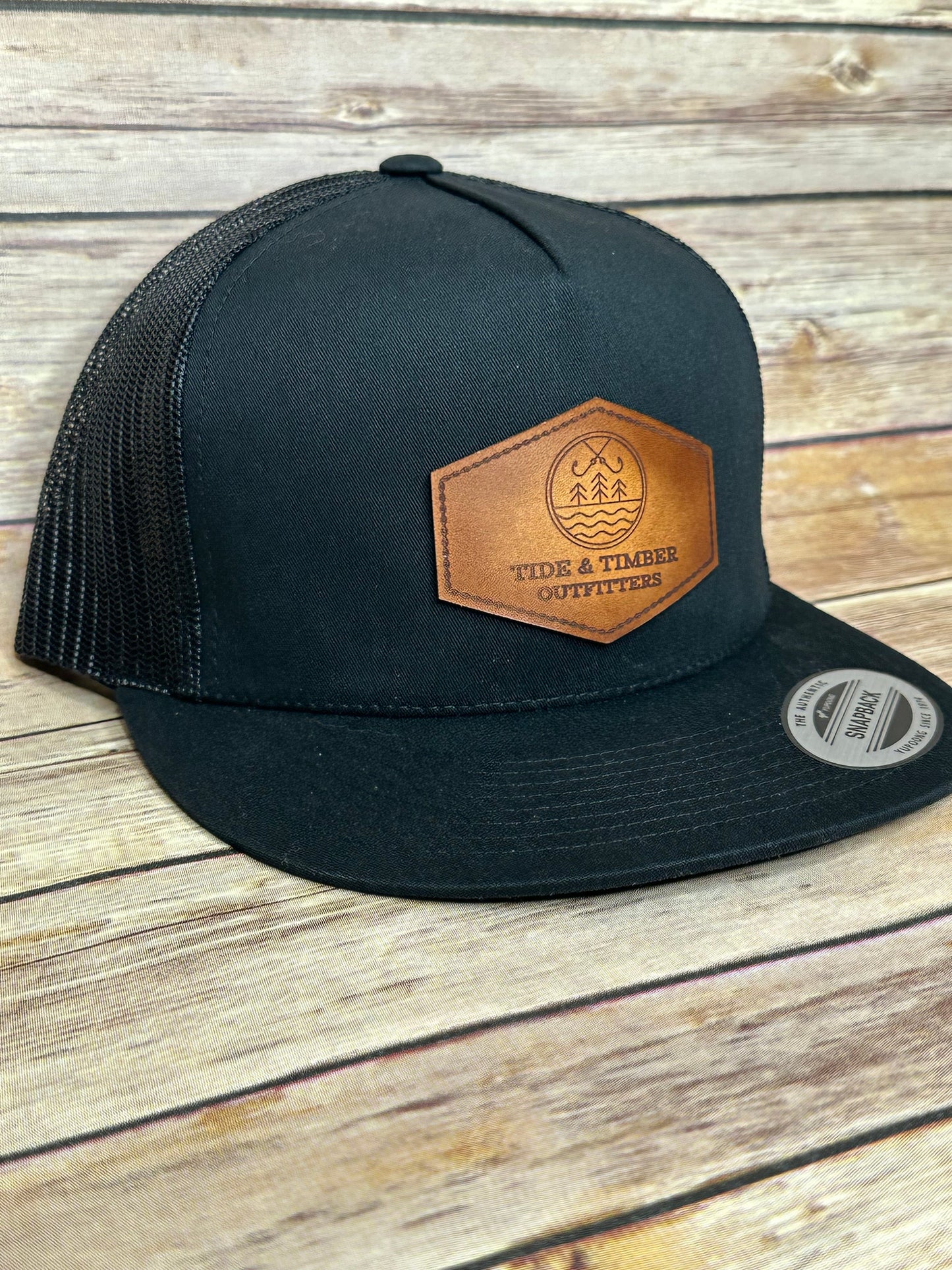 Black flat bill T&T logo trucker hat