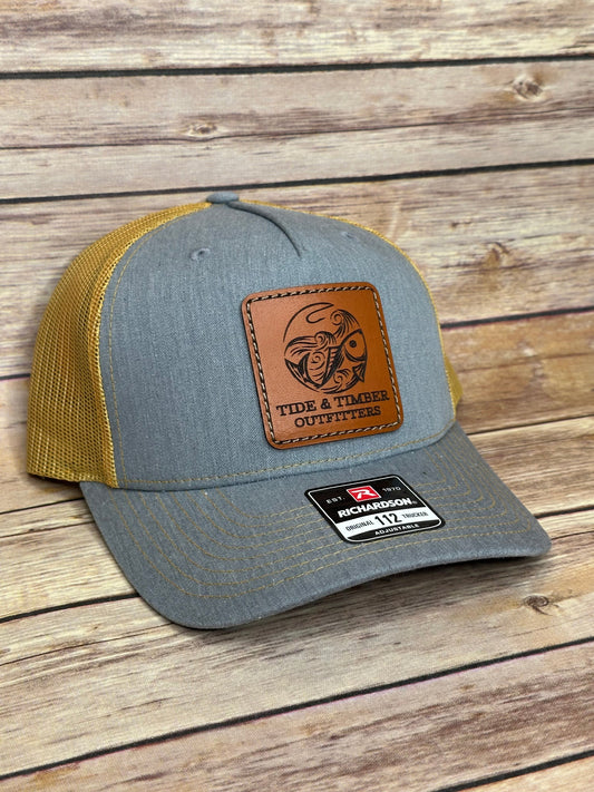 Heather Grey/Amber Gold fish & hook trucker hat