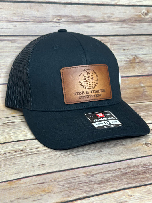 Black T&T logo trucker hat