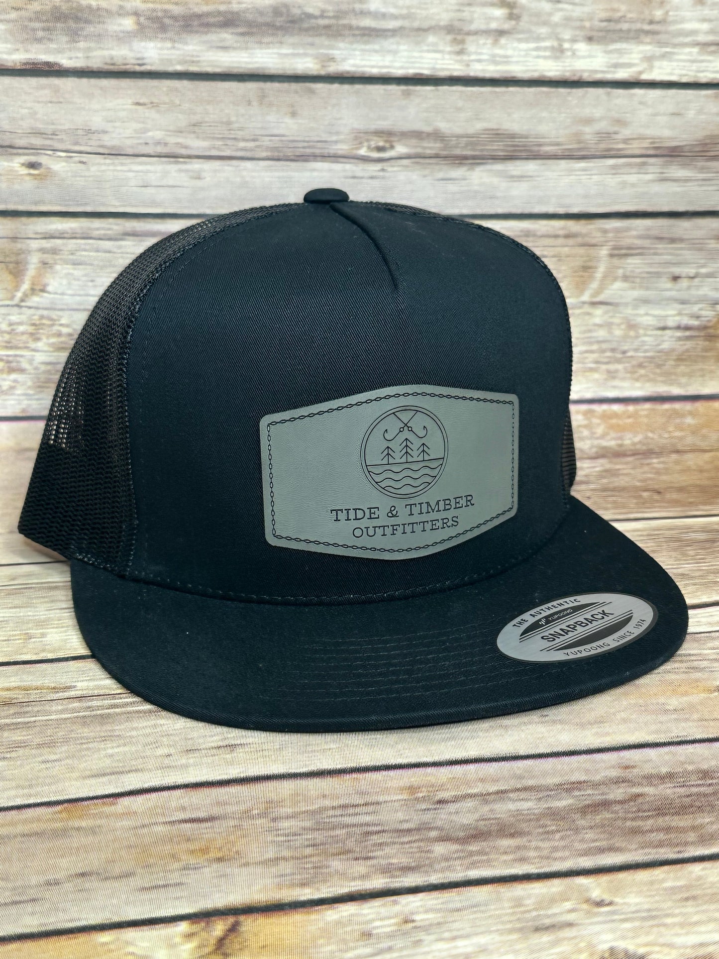 Black flat bill T&T logo trucker hat